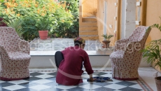 Indian boy cleaning in the hotel